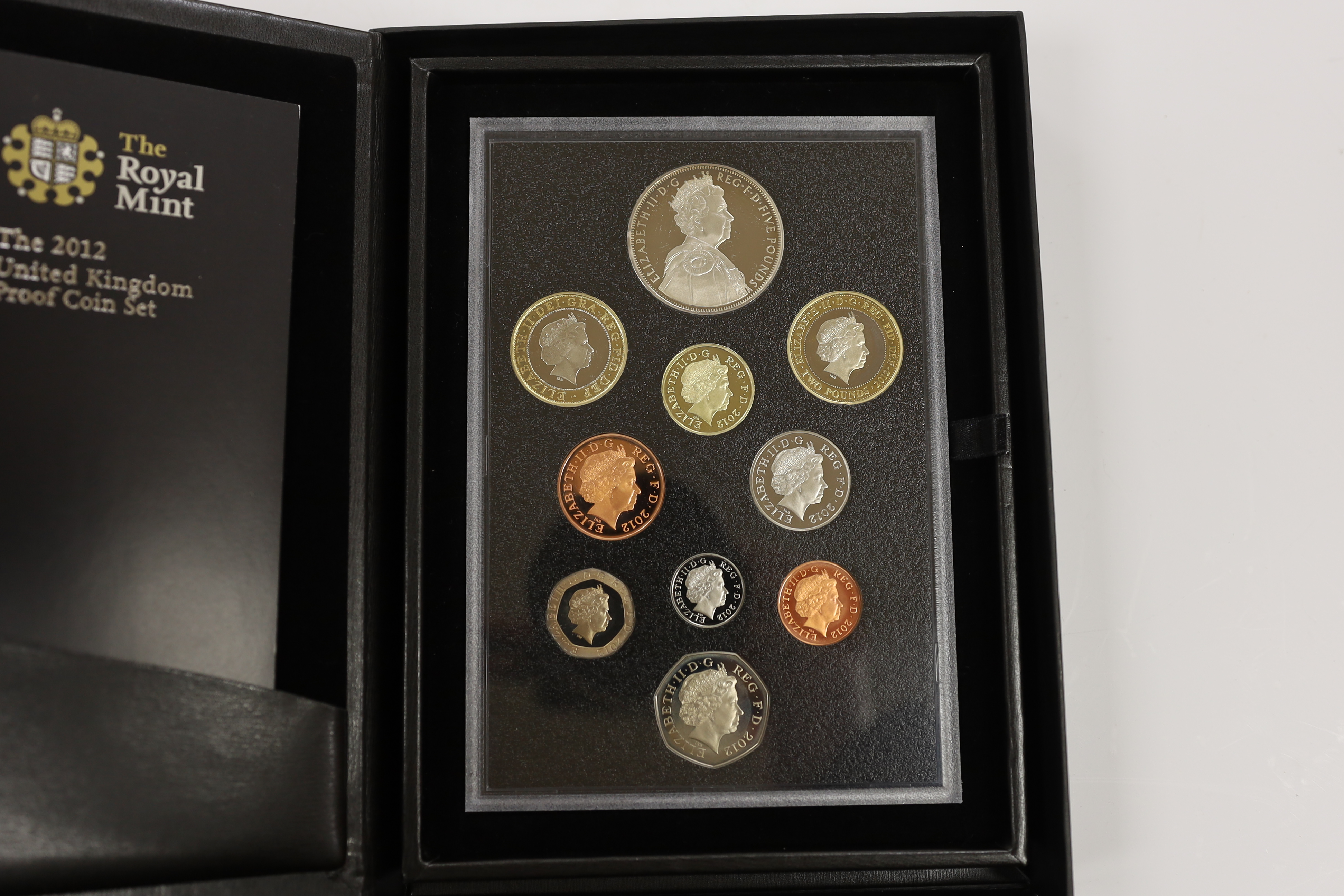 Royal Mint UK QEII proof coin year sets for 2002, 2003, 2005-2008, 2010, 2012 together with two Executive Collections for 2001 & 2004 and a Royal Shield Arms collection 2008, 11 cases